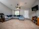 Spacious living room with sectional sofa and large TV at 1436 Ne 161St Pl, Citra, FL 32113