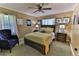 Bedroom with a double bed, armchair and dark wood furniture at 21571 Sw Marine Blvd, Dunnellon, FL 34431