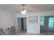 Spacious living room featuring light floors and a ceiling fan at 10886 Sw 87Th Ct, Ocala, FL 34481