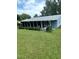 Spacious screened-in porch with lush green lawn at 10886 Sw 87Th Ct, Ocala, FL 34481