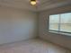 Bright bedroom with tile flooring and a window with blinds at 8719 Sw 76Th Street Rd, Ocala, FL 34481