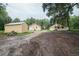 Backyard view of two houses and open space at 1750 Ne 180Th St, Citra, FL 32113