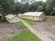 Aerial view of a yellow house and detached garage at 1750 Ne 180Th St, Citra, FL 32113