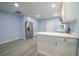 Open concept kitchen with white cabinets and a breakfast bar at 1750 Ne 180Th St, Citra, FL 32113