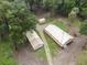 Aerial view showing a yellow house and two outbuildings at 1750 Ne 180Th St, Citra, FL 32113