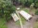 Aerial view of property showing house and sheds at 1750 Ne 180Th St, Citra, FL 32113