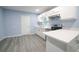 Kitchen with white cabinets, quartz countertops, and stainless steel appliances at 1750 Ne 180Th St, Citra, FL 32113