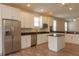 Kitchen island, stainless steel appliances, and hardwood floors at 0 Fisher Lane Way, Ocklawaha, FL 32179