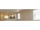 Bright living room with hardwood floors and kitchen view at 0 Fisher Lane Way, Ocklawaha, FL 32179