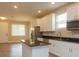 Modern kitchen with stainless steel appliances and granite countertops at 0 Fisher Lane Way, Ocklawaha, FL 32179