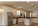 Modern kitchen with white cabinets and stainless steel appliances at 0 Fisher Lane Way, Ocklawaha, FL 32179
