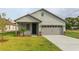 Newly built single-Gathering home with a two-car garage at 0 Fisher Lane Way, Ocklawaha, FL 32179