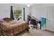 Cozy bedroom with a queen-size bed and a built-in desk at 5851 Sw 86Th Pl, Ocala, FL 34476