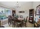 Formal dining room with a chandelier and built-in hutch at 5851 Sw 86Th Pl, Ocala, FL 34476