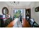 Bright dining room with large windows and decorative accents at 5851 Sw 86Th Pl, Ocala, FL 34476