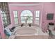 Bathroom with a large bathtub and a window at 5851 Sw 86Th Pl, Ocala, FL 34476