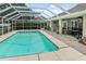 Refreshing screened-in pool with a large backyard at 5851 Sw 86Th Pl, Ocala, FL 34476
