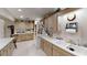 Clean kitchen featuring wood cabinets and a double sink at 8420 Sw 92Nd St # B, Ocala, FL 34481