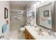 Bathroom with walk-in shower and updated vanity at 8420 Sw 92Nd St # B, Ocala, FL 34481