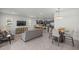 Open dining area with a round table and gray chairs at 7288 Sw 64Th Street Rd, Ocala, FL 34474