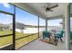 Screened porch with patio furniture and backyard view at 7288 Sw 64Th Street Rd, Ocala, FL 34474