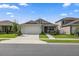 One-story house with a two-car garage and well-manicured lawn at 7288 Sw 64Th Street Rd, Ocala, FL 34474