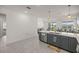 Modern kitchen with gray cabinets and a large island at 7288 Sw 64Th Street Rd, Ocala, FL 34474