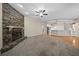 Living room with stone fireplace and carpet flooring at 1989 Nw 111Th Loop, Ocala, FL 34475
