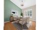 Bright dining room with hardwood floors and an accent wall at 1989 Nw 111Th Loop, Ocala, FL 34475