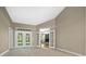 Large bedroom with french doors leading to backyard at 1989 Nw 111Th Loop, Ocala, FL 34475