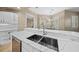 Spacious kitchen featuring white cabinets, quartz countertops, and stainless steel appliances at 1989 Nw 111Th Loop, Ocala, FL 34475