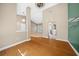 Bright dining room with hardwood floors and views into adjacent rooms at 1989 Nw 111Th Loop, Ocala, FL 34475