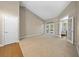 Large living area with hardwood floors, access to a patio, and high ceilings at 1989 Nw 111Th Loop, Ocala, FL 34475