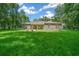 Single story home with stone accents and a green lawn at 1989 Nw 111Th Loop, Ocala, FL 34475