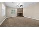 Living room with stone fireplace and carpet flooring at 1989 Nw 111Th Loop, Ocala, FL 34475