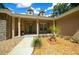 One-story home with stone accents and a welcoming porch at 1989 Nw 111Th Loop, Ocala, FL 34475