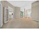 Spacious living room with carpet and access to other rooms at 1989 Nw 111Th Loop, Ocala, FL 34475