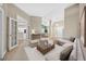 Living room with staged furniture and views into other rooms at 1989 Nw 111Th Loop, Ocala, FL 34475