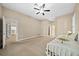 Well-lit bedroom with neutral walls and carpeted floors at 1989 Nw 111Th Loop, Ocala, FL 34475