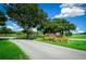 Ocala Downs entrance with stone signage and landscaping at 1989 Nw 111Th Loop, Ocala, FL 34475