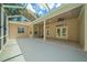 Spacious screened porch with double doors leading into the house at 1989 Nw 111Th Loop, Ocala, FL 34475