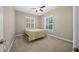 Bright bedroom with ceiling fan and neutral carpeting at 1989 Nw 111Th Loop, Ocala, FL 34475