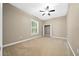 Bedroom with ceiling fan and neutral wall colors at 1989 Nw 111Th Loop, Ocala, FL 34475