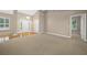 Living room with hardwood floors and access to the front door at 1989 Nw 111Th Loop, Ocala, FL 34475