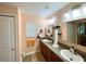 Bathroom with double vanity and updated fixtures at 16376 Sw 13Th Ter, Ocala, FL 34473