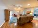 Open concept living area with hardwood floors and comfortable furniture at 16376 Sw 13Th Ter, Ocala, FL 34473