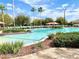 Inviting community pool with palm trees and seating at 16376 Sw 13Th Ter, Ocala, FL 34473