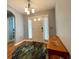 Inviting entryway featuring wood floors and a stylish rug at 16376 Sw 13Th Ter, Ocala, FL 34473