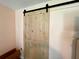 Stylish barn door adds character to the room at 16376 Sw 13Th Ter, Ocala, FL 34473
