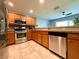 Spacious kitchen with stainless steel appliances and granite countertops at 16376 Sw 13Th Ter, Ocala, FL 34473